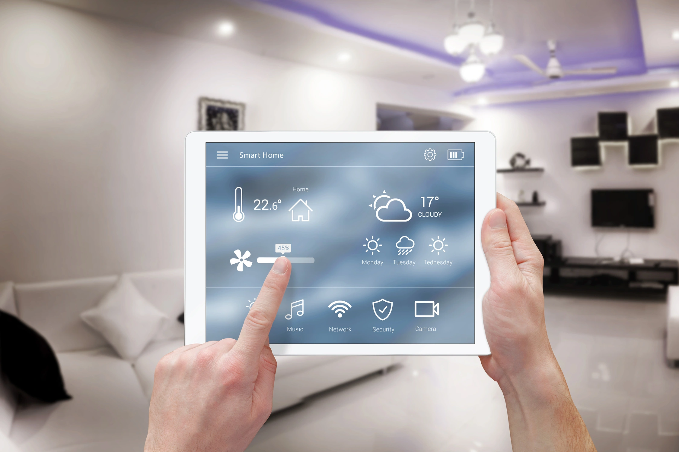 person adjusting thermometer on tablet