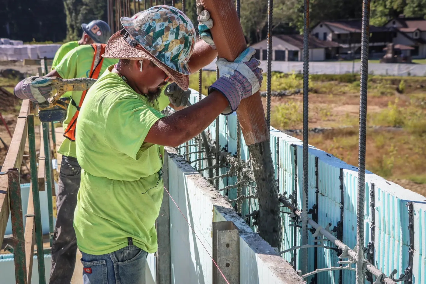 installer pouring concrete into ICF